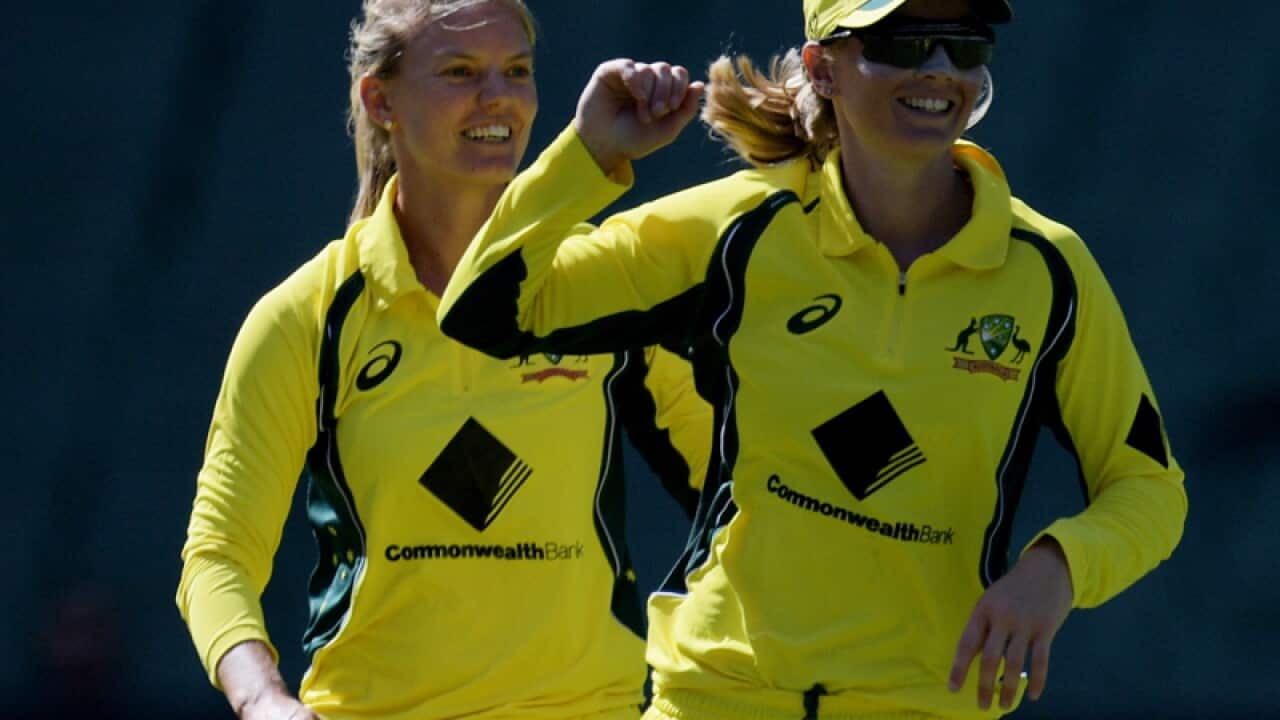Kristen Beams (left) celebrates with Australian captain Meg Lannin