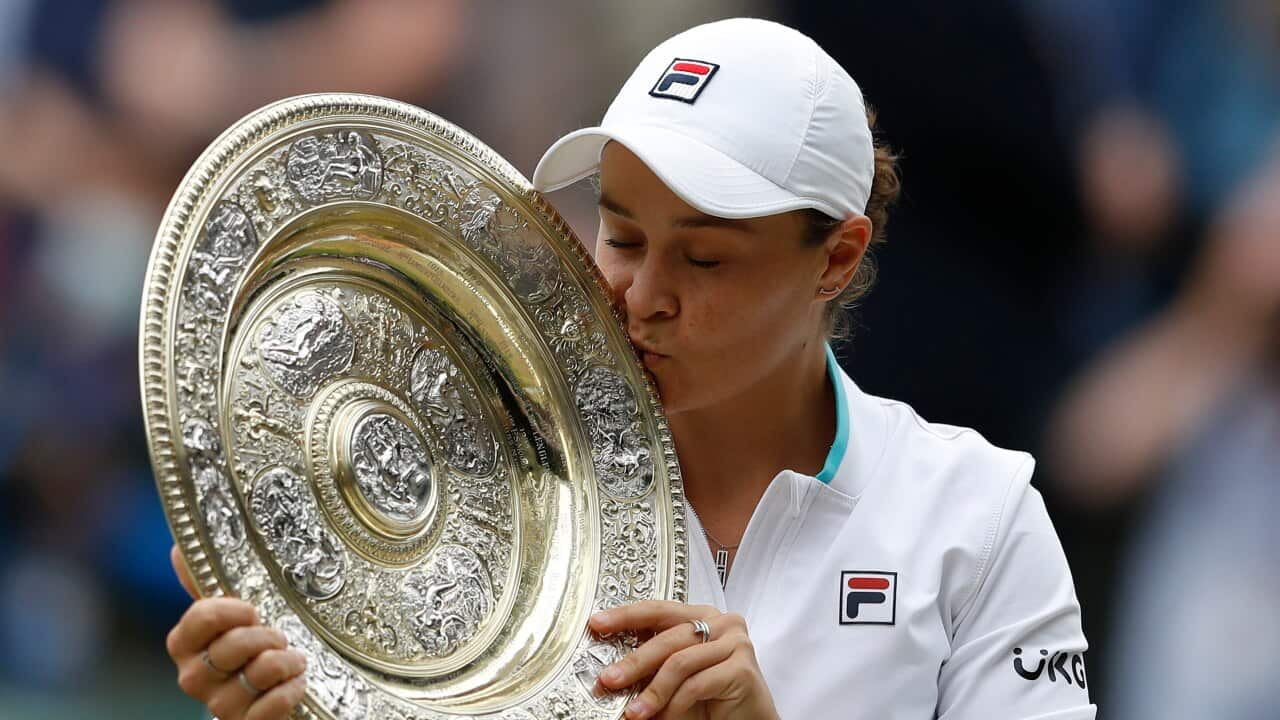 Ash Barty with Wimbledon trophy