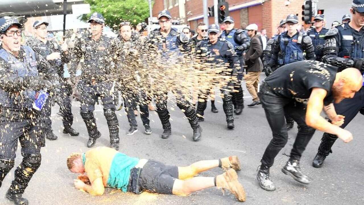Protesters clash with police at Milo Yiannopoulos event.