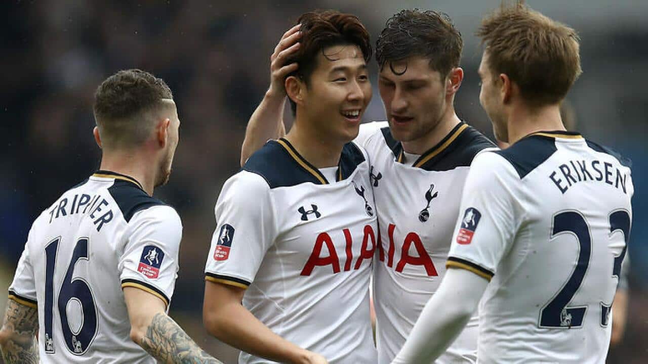 Son Heung-min, second left, is congratulated after netting his first and Tottenham's second