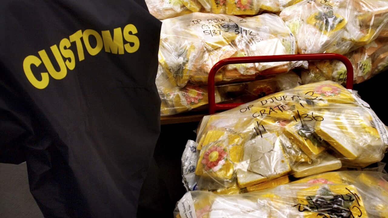Sydney, September 12, 2003. Australian Federal Police and Customs officers show off Australia's largest ever pseudoephedrine hau