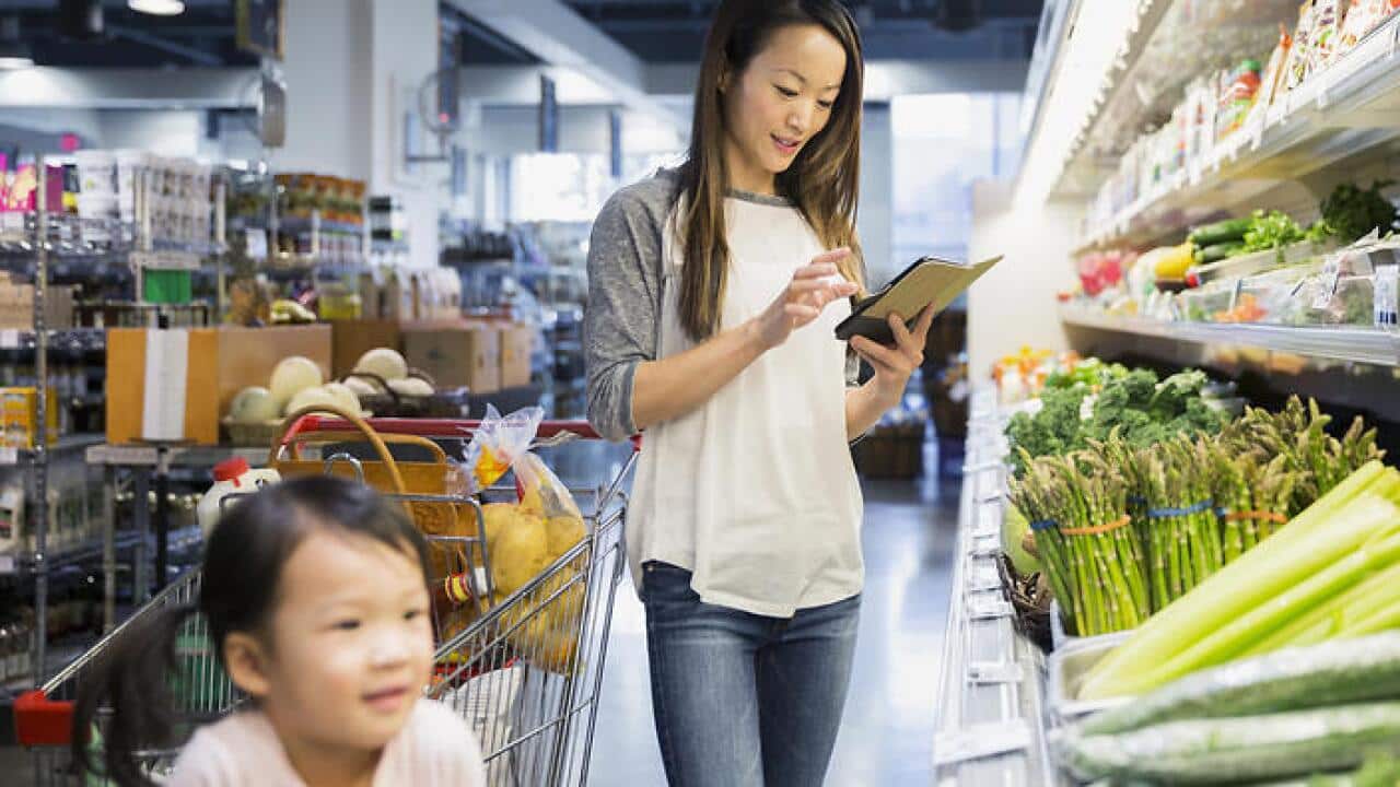 Mother and daughter shopping with digital tablet