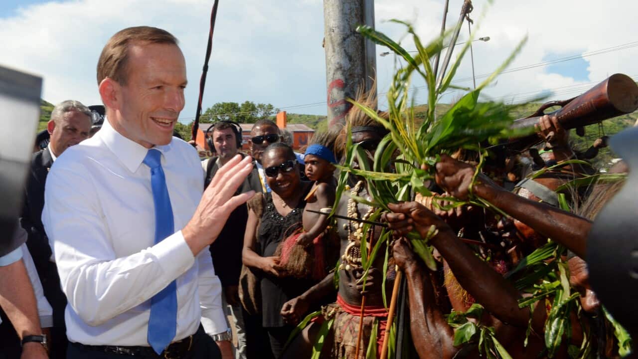 Prime Minister Tony Abbott during a visit to the Koki markets at Ela Beach in Port Moresby - AAP-1.jpg