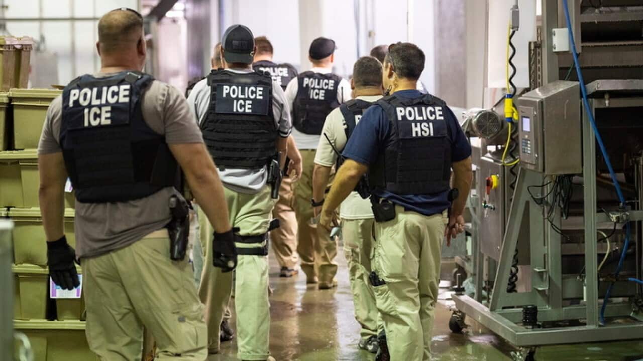 ICE officials and police during the raid in Mississippi.