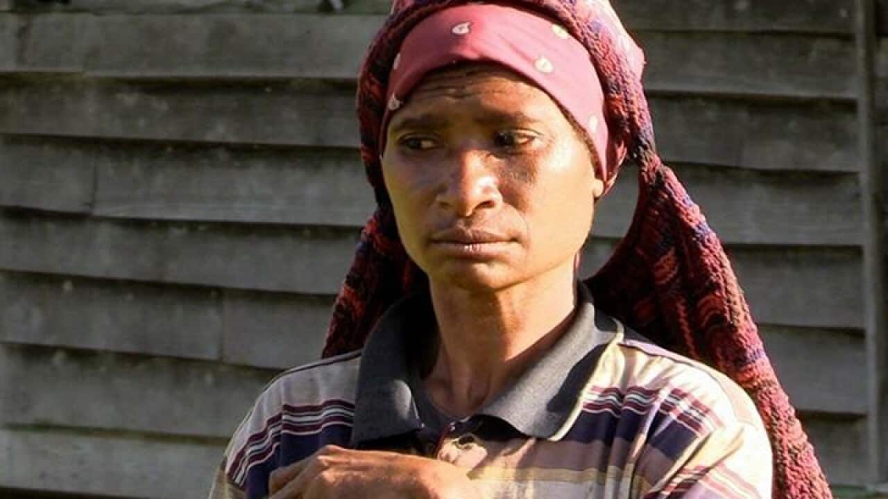 A PNG woman reported axed to death after being accused of sorcery.