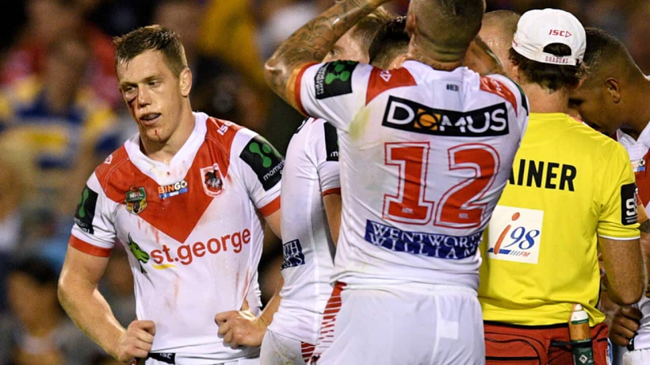 Cameron McInnes(left) of the Dragons