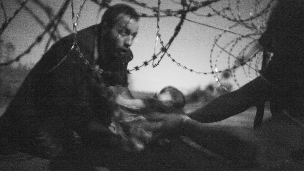 A handout image provided by the World Press Photo (WPP) organization shows a picture by Australian photographer Warren Richardson that won the World Press Photo of the Year award and 1st prize singles in the Spot News category of the 59th annual World Pre