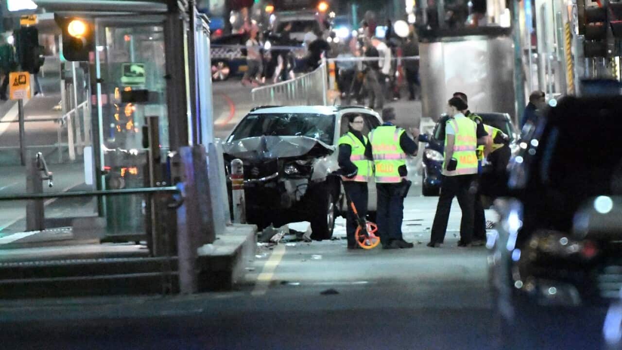 A damaged vehicle is seen at the scene of an incident on Flinders Street, in Melbourne, Thursday, December 21, 2017.