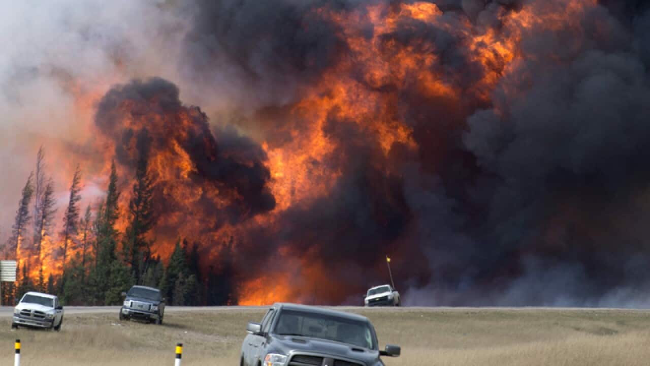 A wildfire burns south of Fort McMurray, Alberta