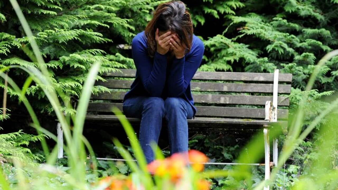 a woman showing signs of depression.
