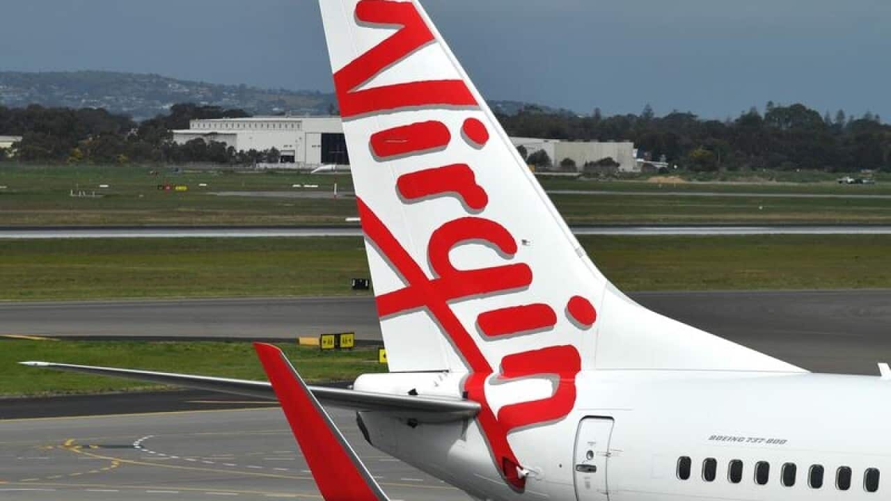 Virgin is written on the tail of a plane