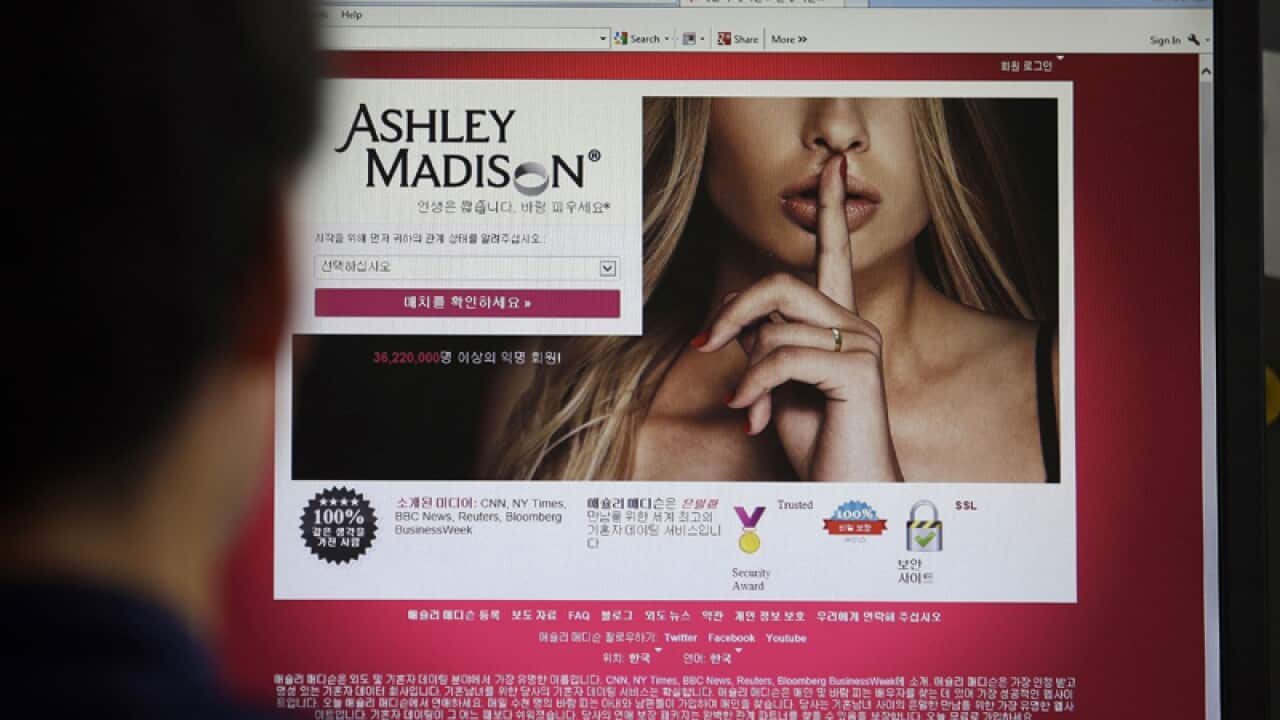 A person views the Ashley Madison dating site on a computer