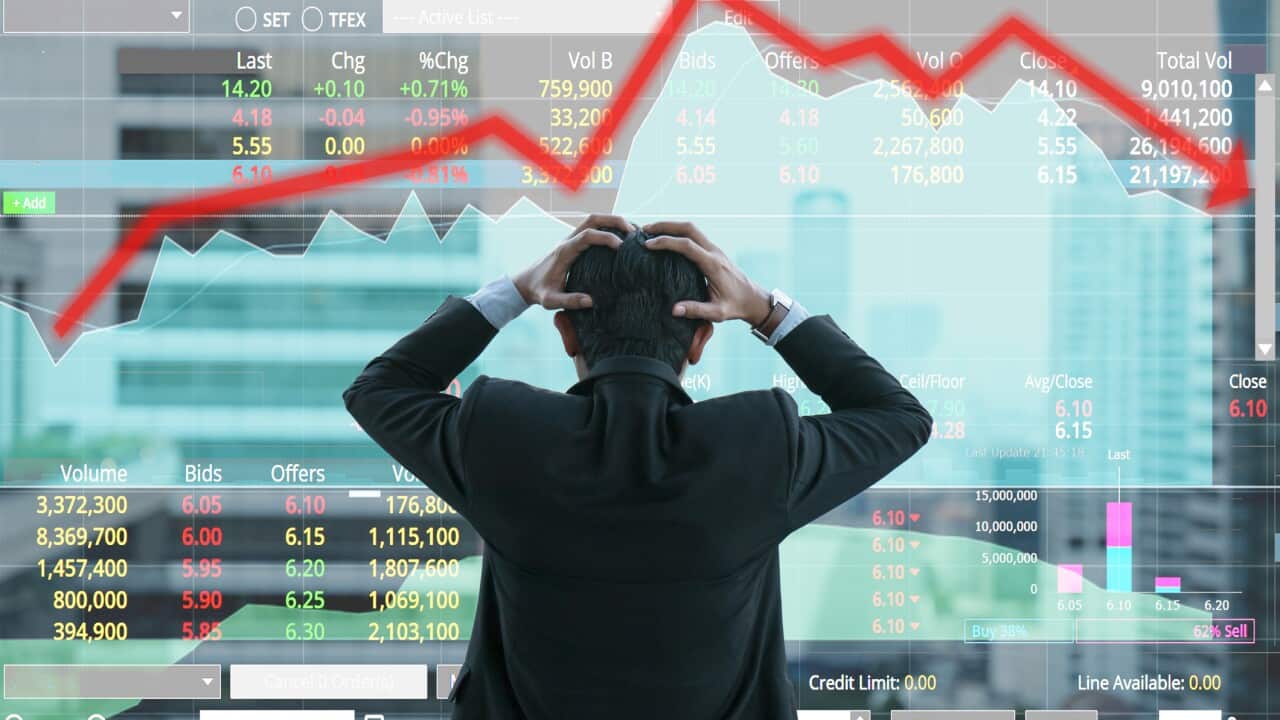 Businessman grabs the head concept with business chart on scoreboard