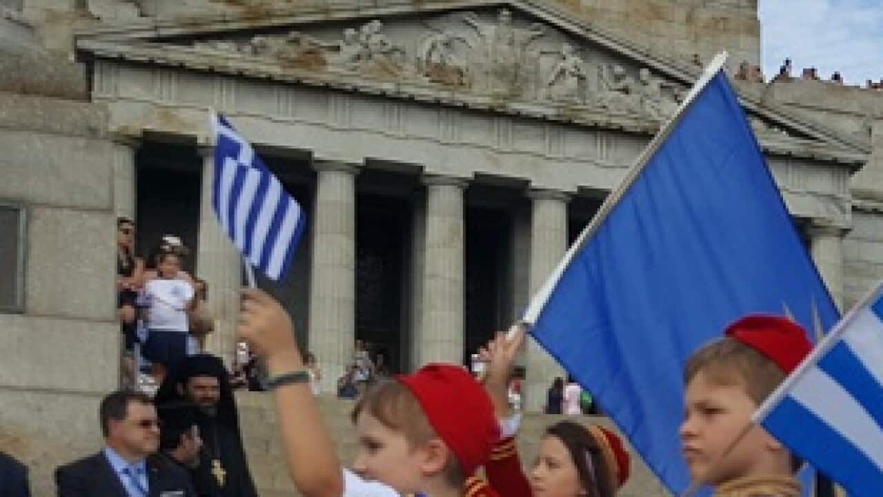 Greek Australian kids marching in front of Melbourne's Shrine of Remembrance on Greek National Day