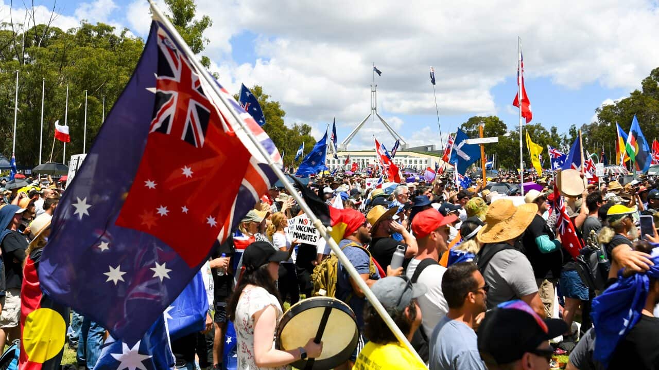 Thousands of people take part in a ‘Convoy to Canberra’ protest outside Parliament House in Canberra, Saturday, February 12, 2022. (AAP Image/Lukas Coch) NO ARCHIVING