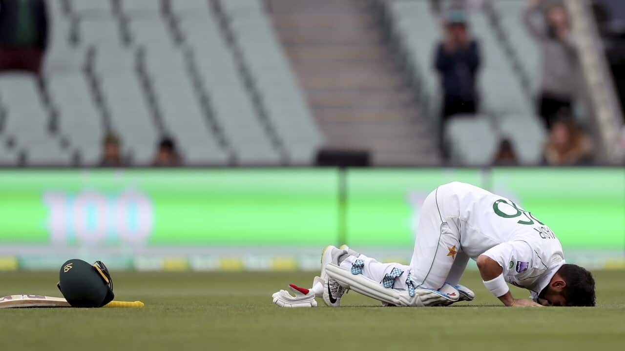 Yasir Shah kisses the turf after reaching his maiden test century