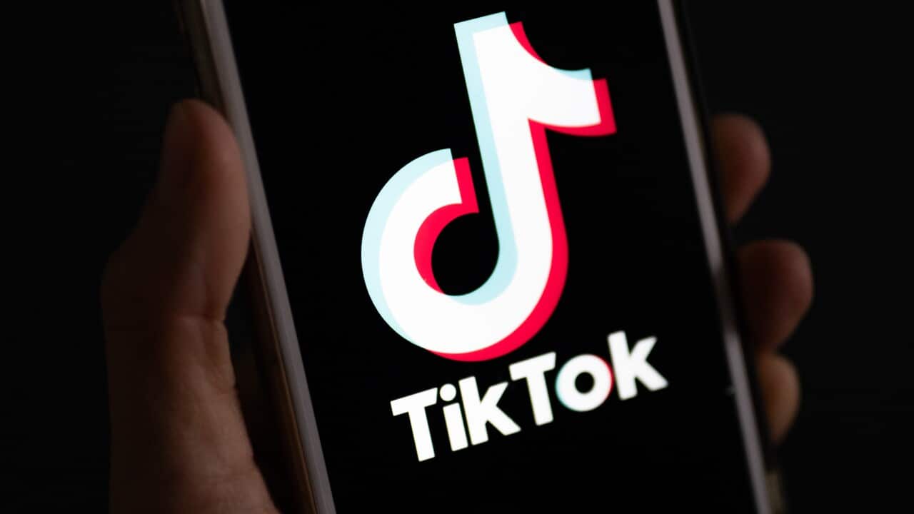 The TikTok logo on a phone screen
