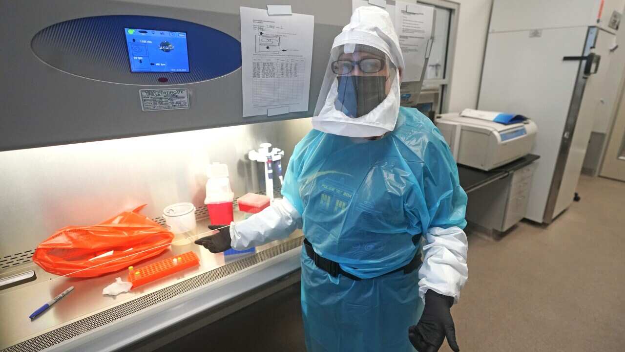 Micro-biologist Annette Atkinson looks on during a demonstration how the monkeypox is tested for at the Utah Public Health Laboratory Friday, July 29, 2022, in Taylorsville, Utah. (AP Photo/Rick Bowmer)