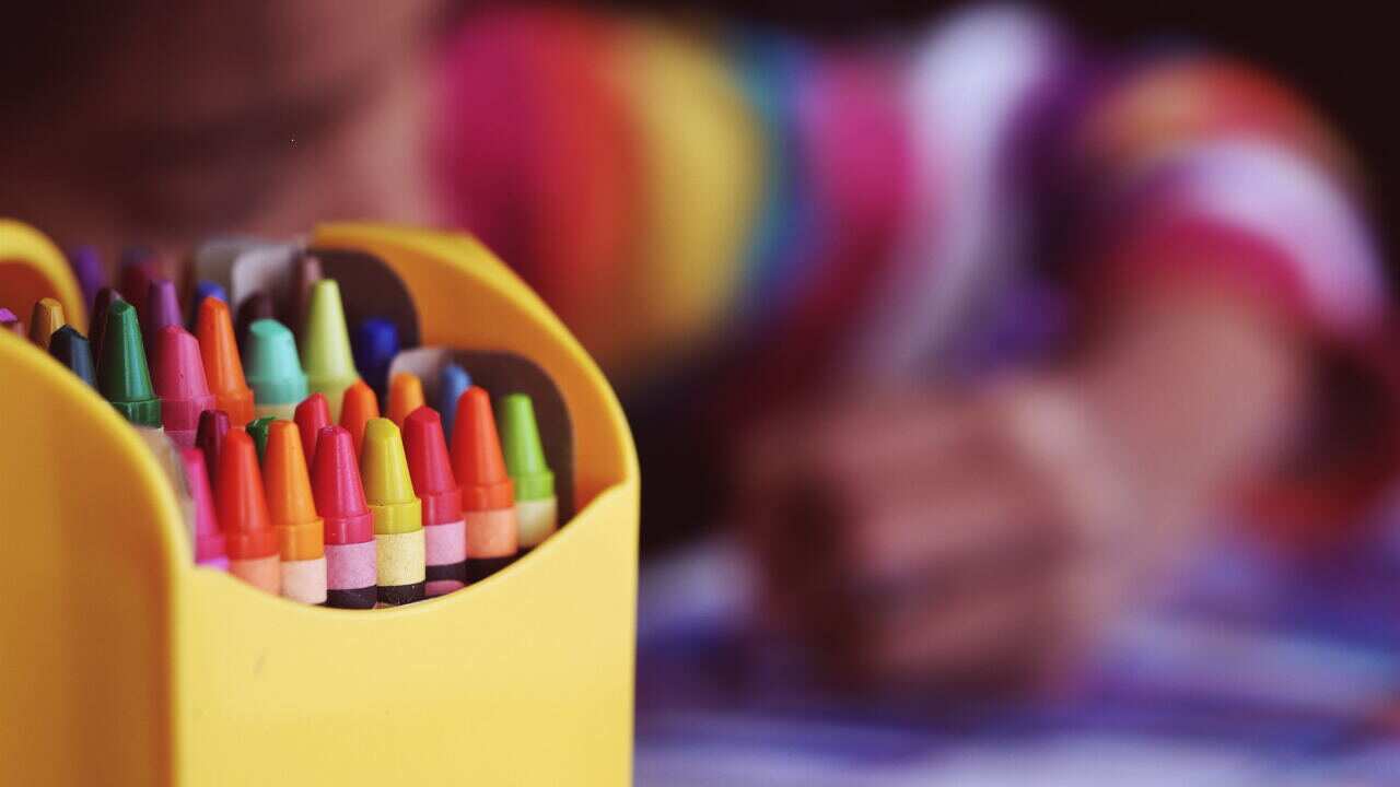 Coloured crayons in a box