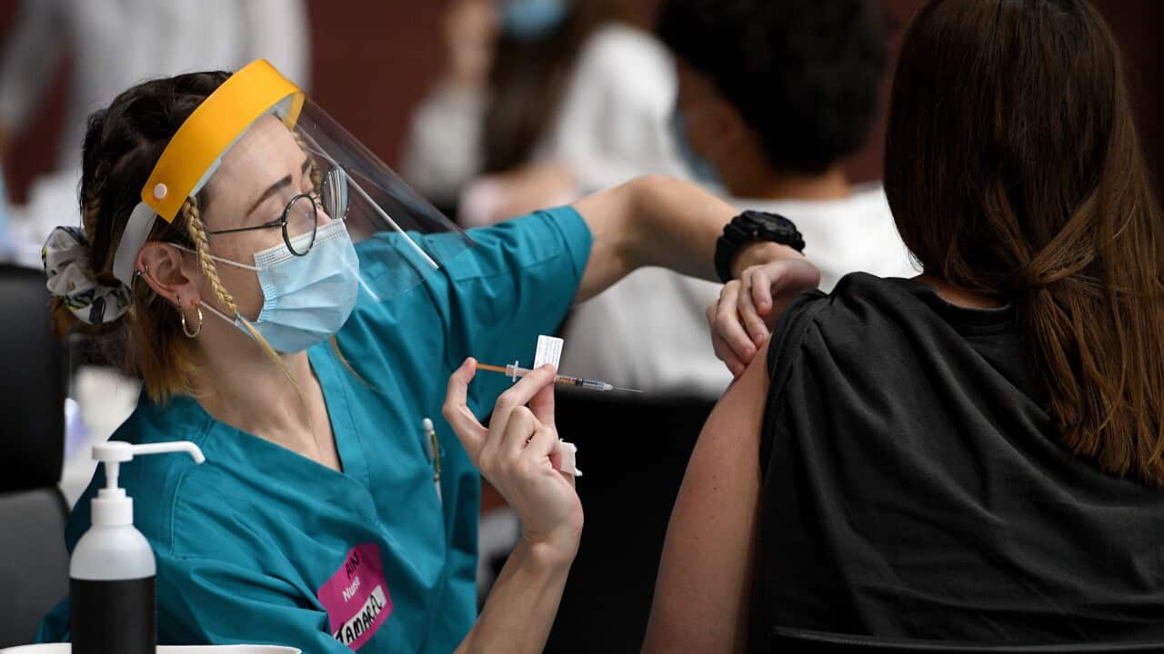 Members of the Indigenous community are seen receiving a Covid-19 vaccine at a pop-up vaccination clinic at the National Centre of Indigenous Excellence in Redfern, Sydney, Saturday, September 4, 2021. (AAP Image/Dan Himbrechts) NO ARCHIVING