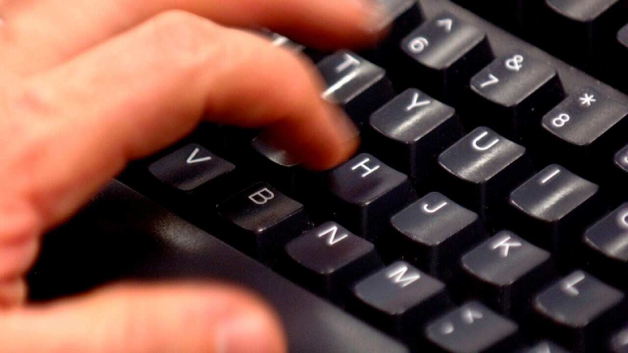 A person using a computer keyboard