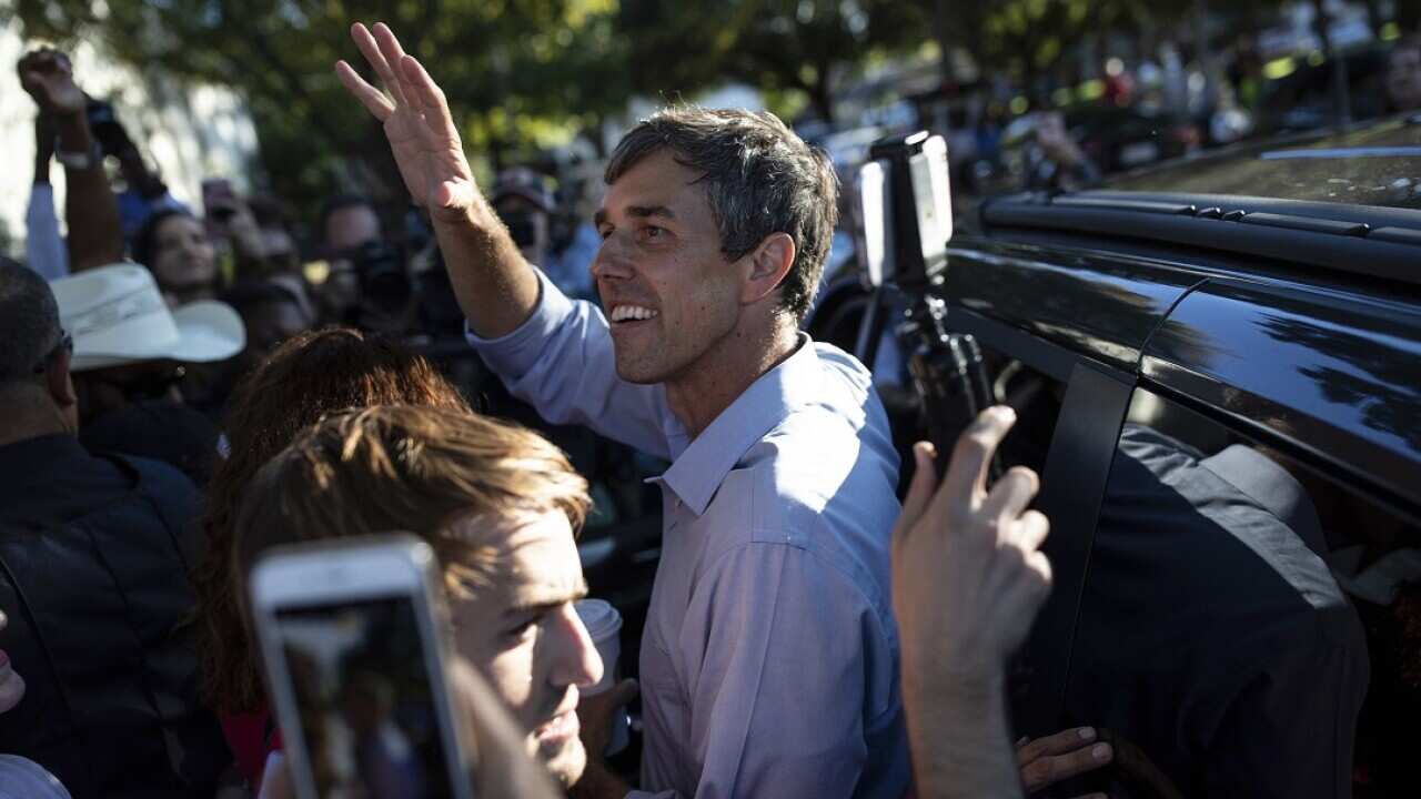 Rep. Beto O'Rourke, the Democratic candidate for Texas Senate, waves to supporters as he leaves a campaign event in Dallas.