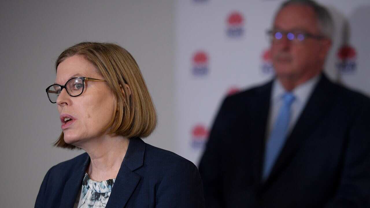 NSW Chief Health Officer Dr Kerry Chant (L) and NSW Health Minister Brad Hazzard address the media.