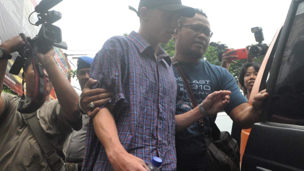 Australian teenager Jamie Murphy is escorted at Kuta police station