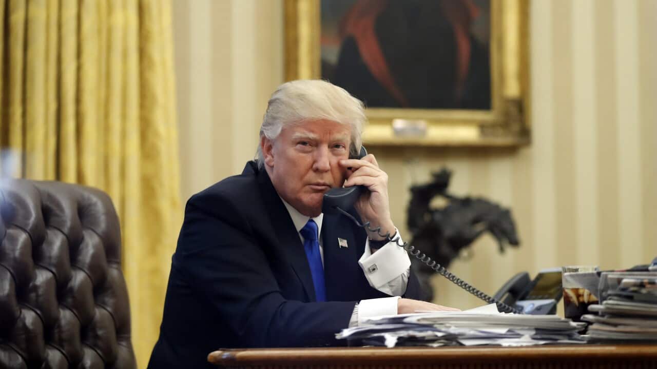 FILE - In this Jan. 28, 2017 file photo, President Donald Trump speaks on the phone with Prime Minister of Australia Malcolm Turnbull in the Oval Office of the White House in Washington. (AP Photo/Alex Brandon, File)