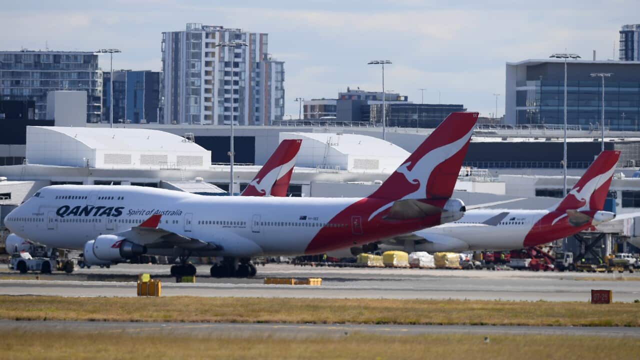 Planes on the tarmac at an airport.