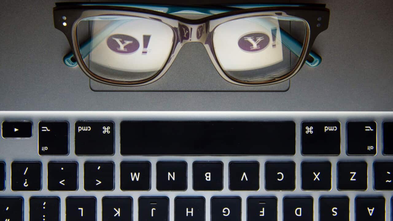 The Yahoo logo reflected in a pair of glasses