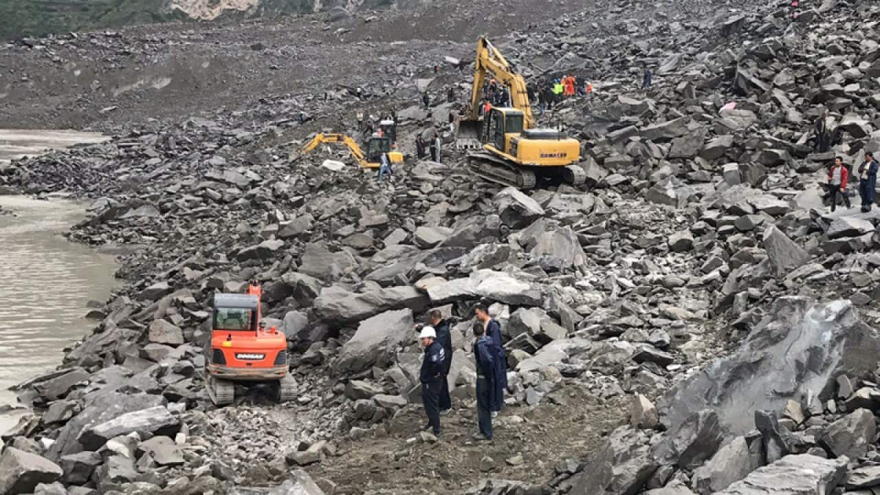 Rescuers work at the landslide site