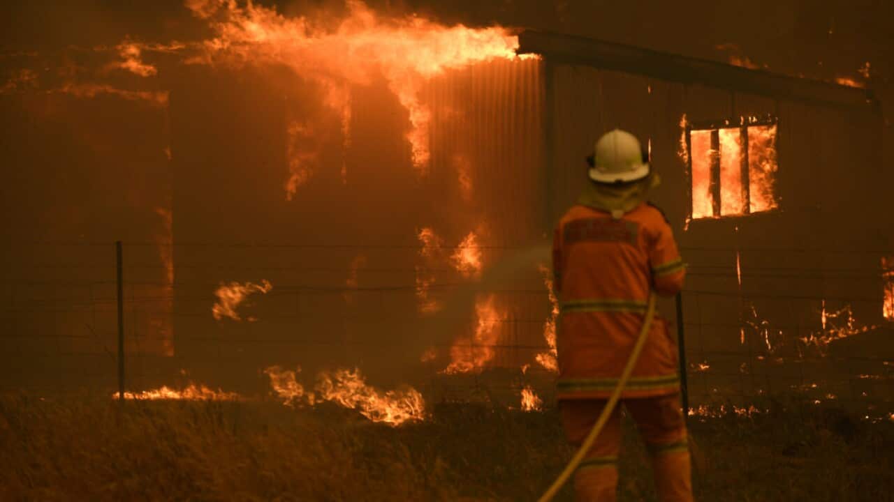 NSW Rural Fire Service crews fight the Gospers Mountain Fire as it impacts a property at Bilpin, Saturday, 21 December, 2019.