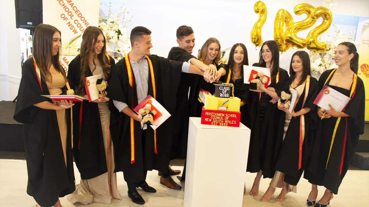 Macedonian Language Graduates Class 2022 in Sydney cutting their special cake