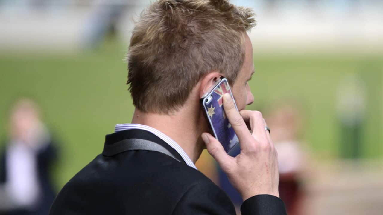 A man talks on his mobile phone