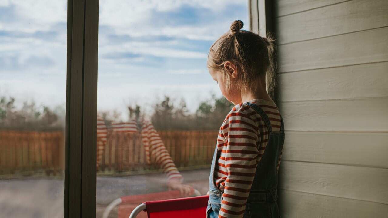Girl looking out a Window