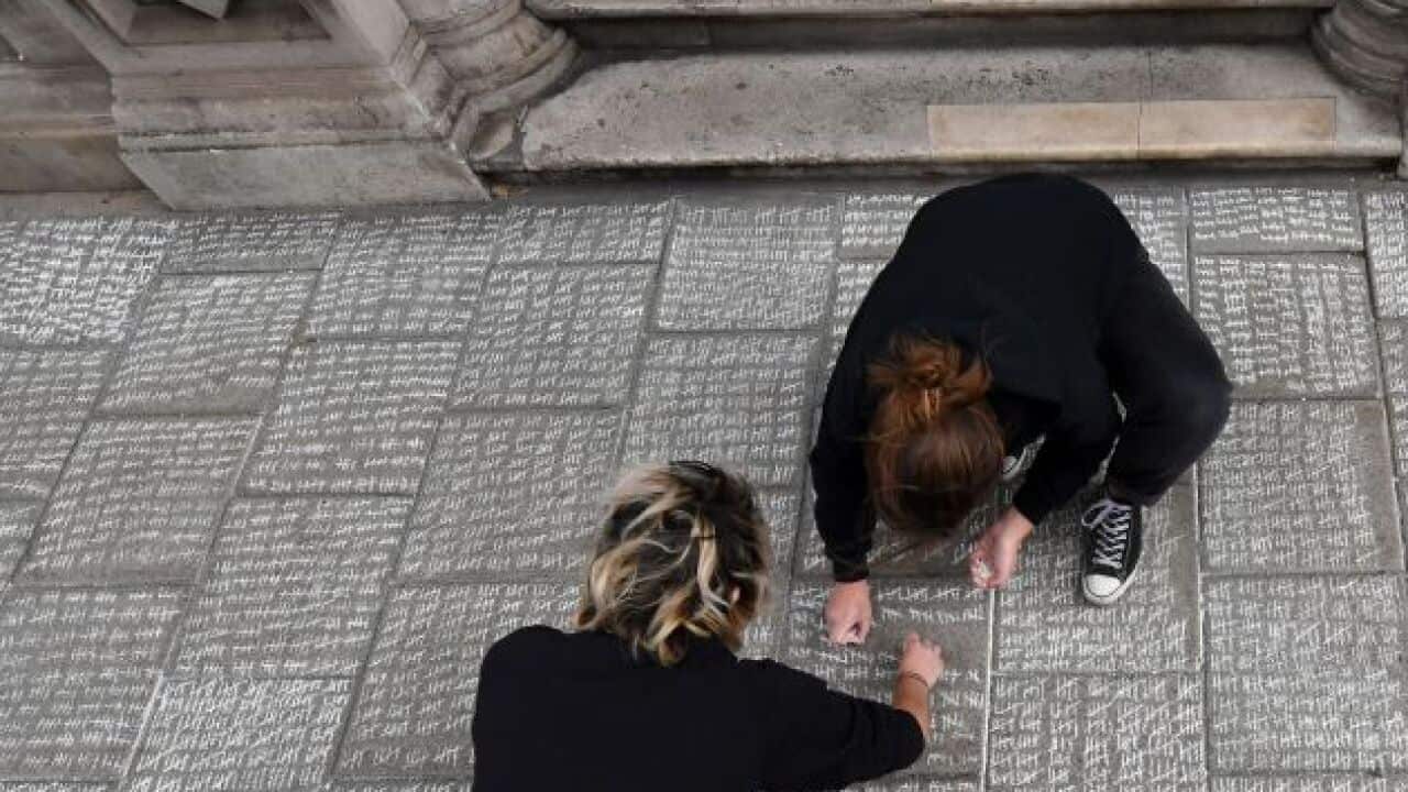 Pro-choice protesters make marks outside Irish Embassy in London