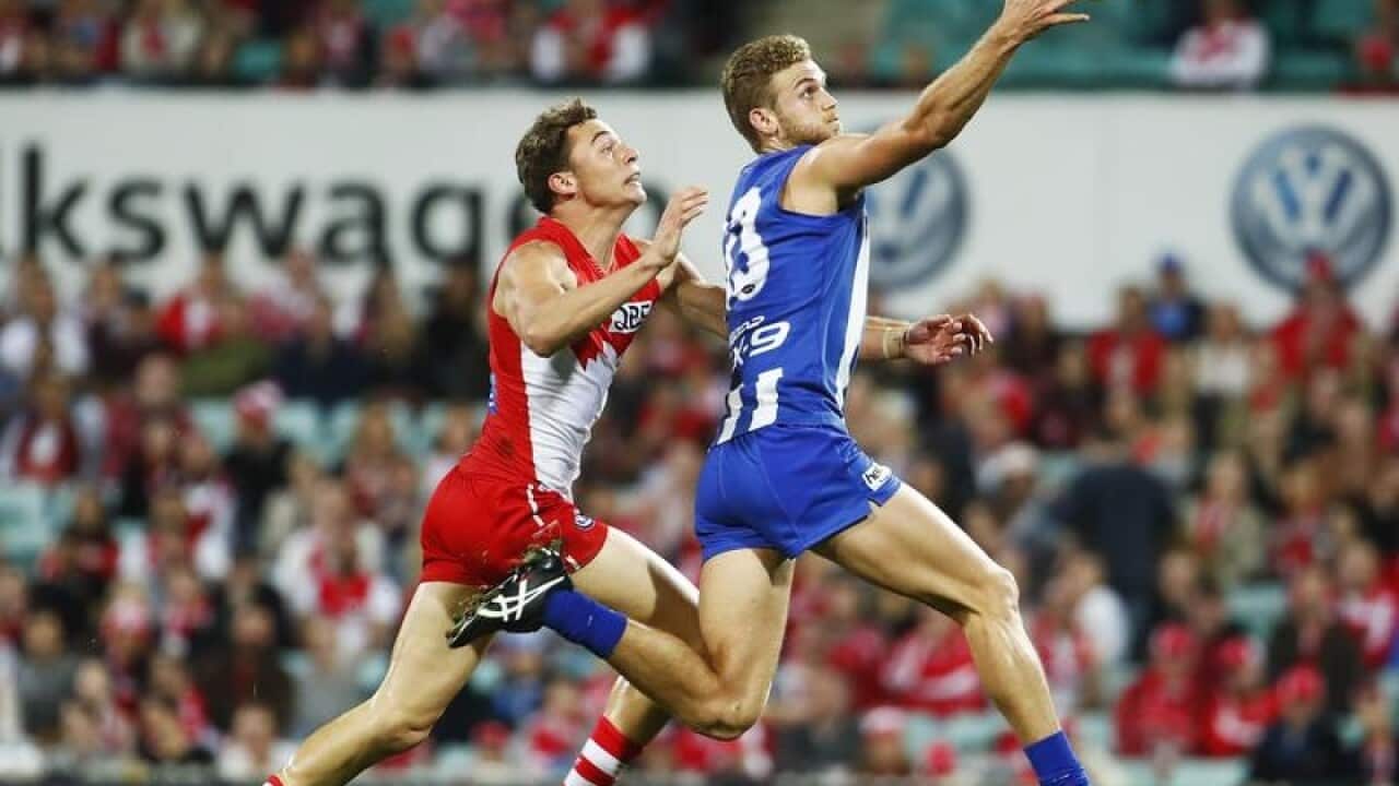 Will Hayward of the Swans contests a mark.