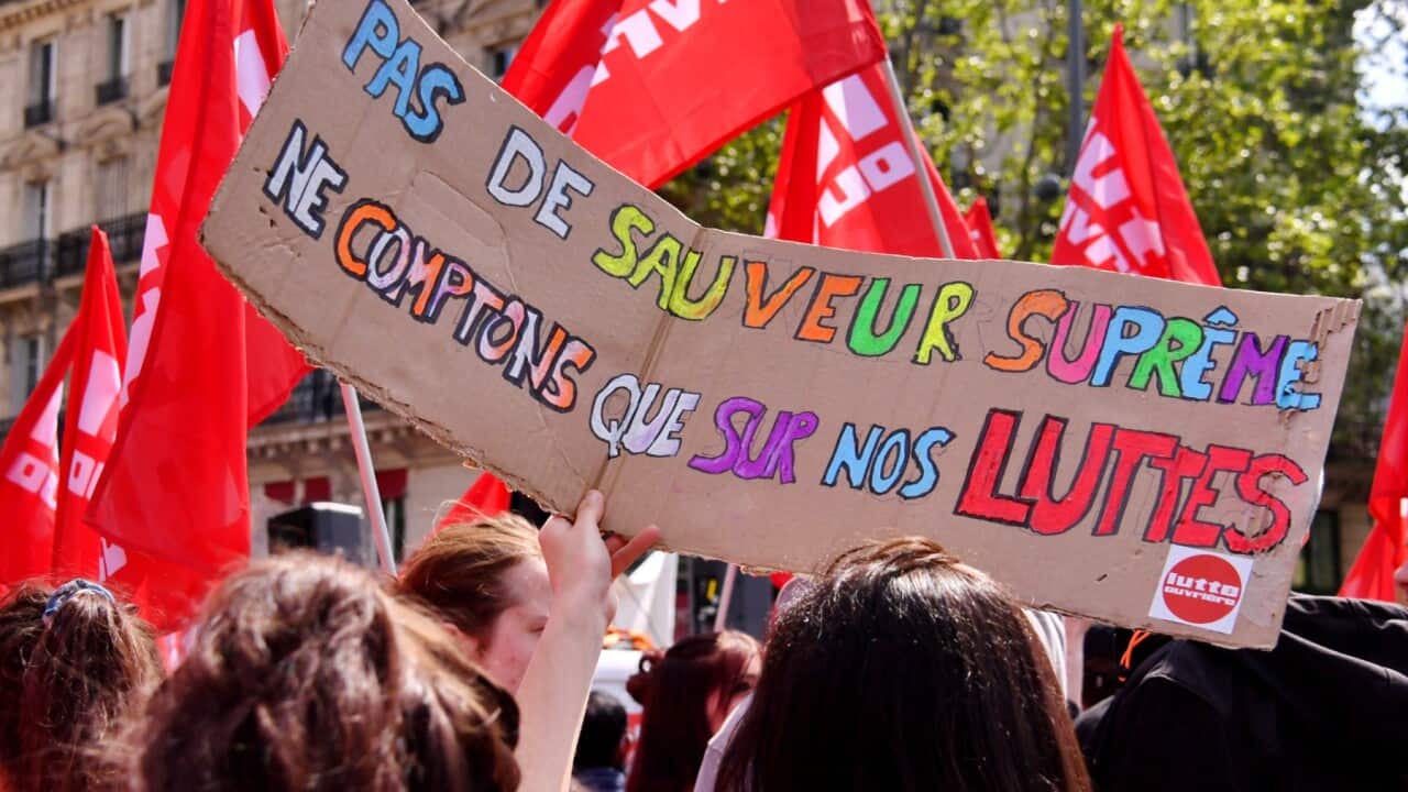 Protesters march during the annual May Day (Labour Day) rally, marking International Workers' Day, in Paris on May 1, 2022.