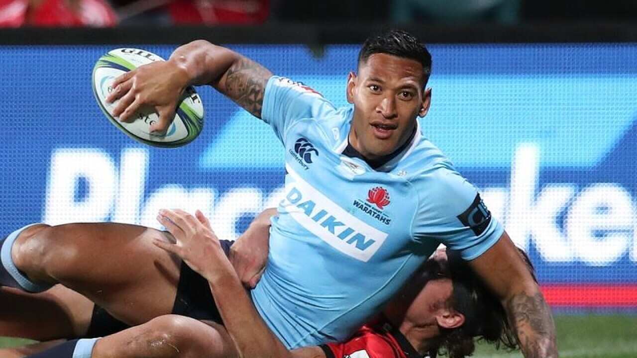 Israel Folau of the Waratahs celebrates scoring a try.