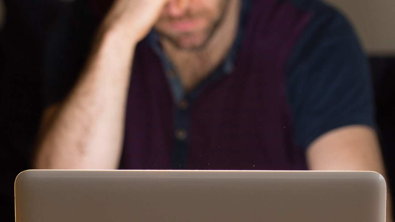 Man using laptop.