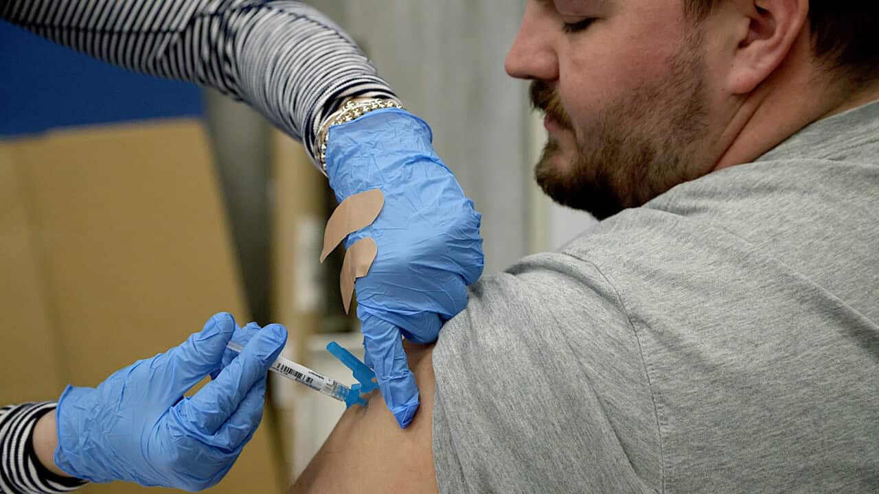 Boston residents line up to get vaccinated at City Hall's free clinic