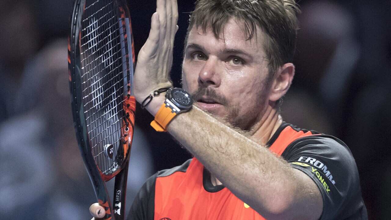 Switzerland's Stan Wawrinka cheers after winning
