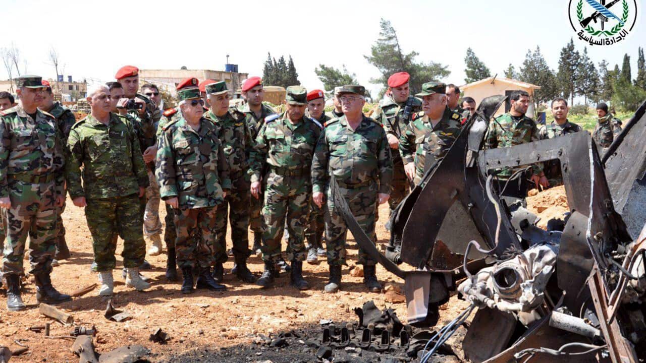File: Syrian Chief of the General Staff of the Army and Armed Forces Gen. Ali Abdullah Ayoub inspecting the damage in al-Shairat Air Base