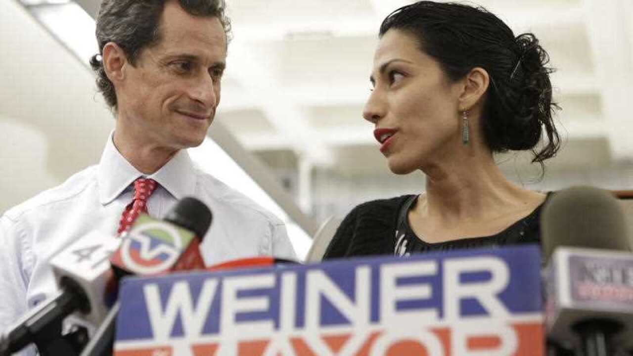 In this July 23, 2013 file photo, Huma Abedin, alongside her husband, then-New York mayoral candidate Anthony Weiner, speaks during a news conference