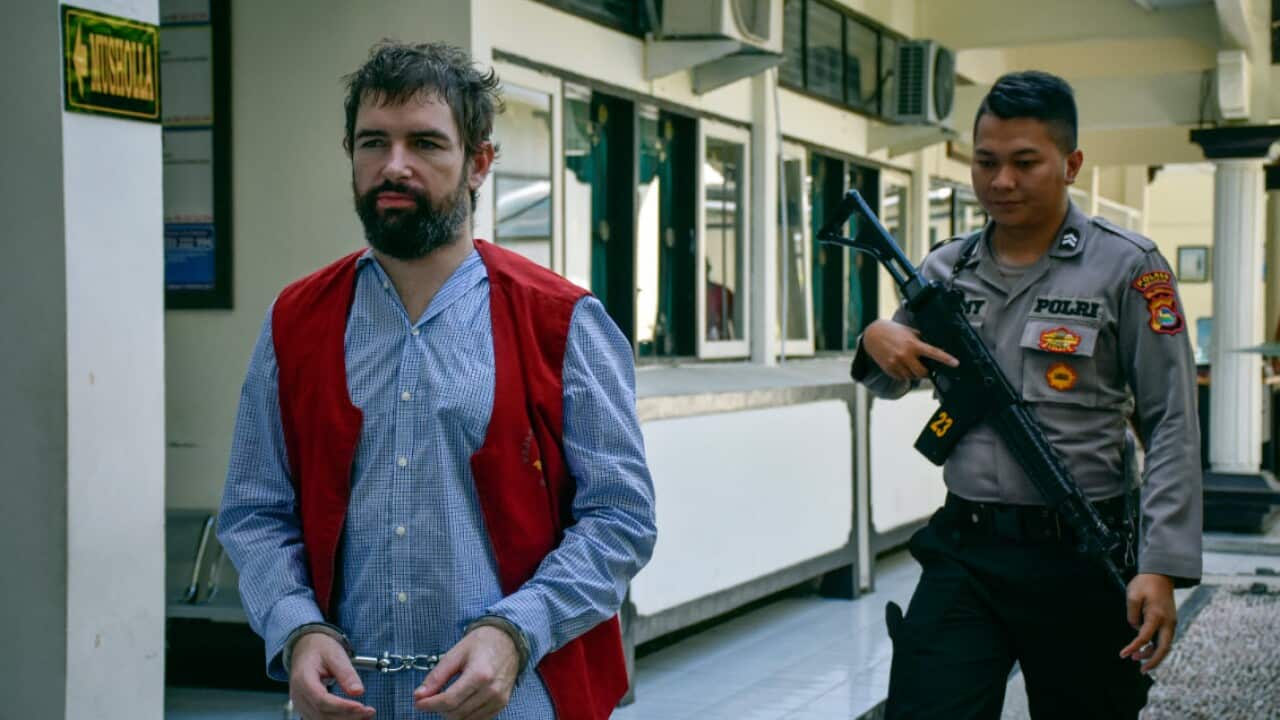 Felix Dorfin of France (L) arrives for his trial at a court in Mataram, Lombok island, Indonesia, 20 May 2019 (AAP)