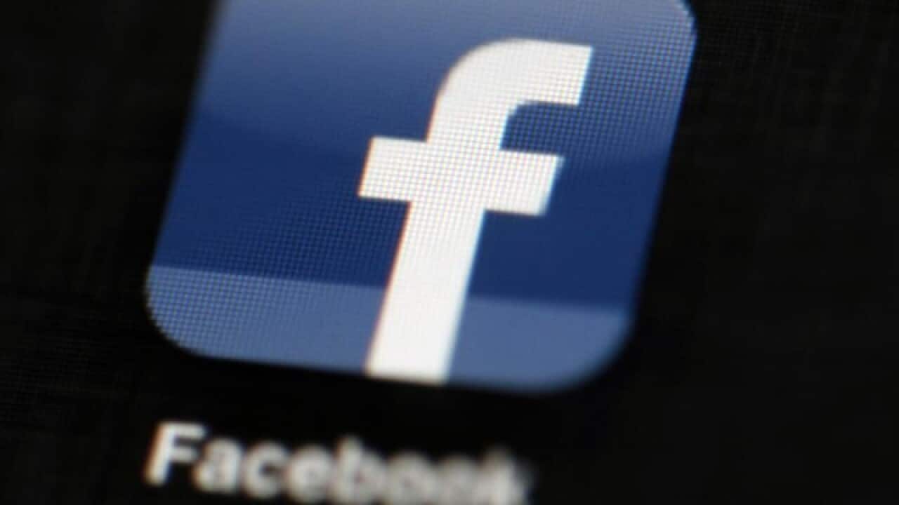 A file image of the Facebook logo on a tablet