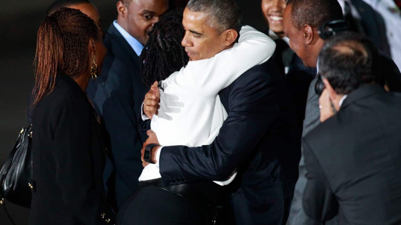 Barack Obama (3-R) hugs from his half-sister Auma Obama (2-L)
