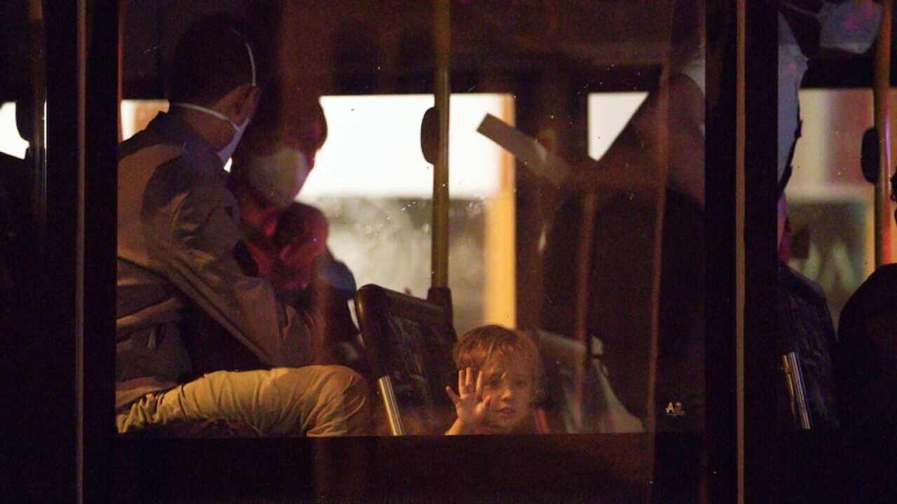 Evacuees from Afghanistan are seen arriving at the Hyatt hotel in Perth, Friday, August 20, 2021