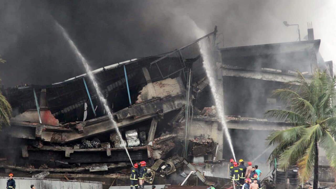 Firefighters try to douse flames at a factory explosion in Bangladesh